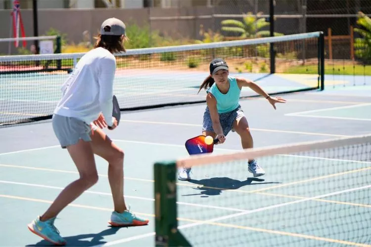 How do you return a low shot in pickleball